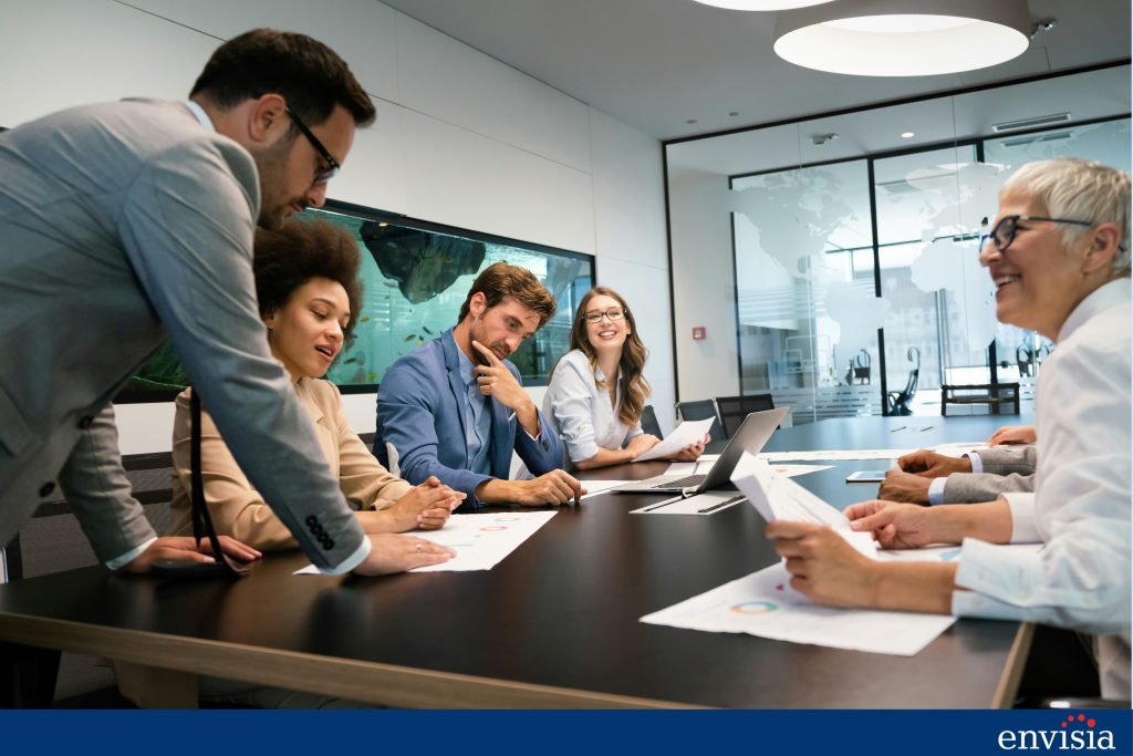 Team members engaging in a discussion during a feedback session, representing collaborative feedback in the 360-degree review process.