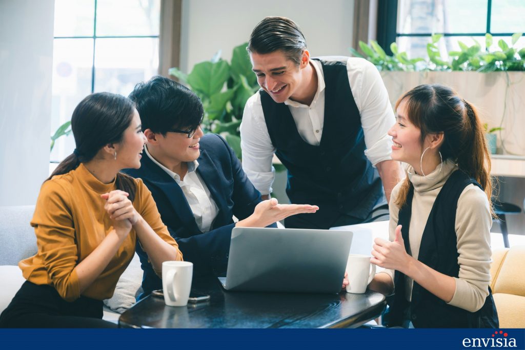 Team members collaborating during a feedback session in a 360-degree review.