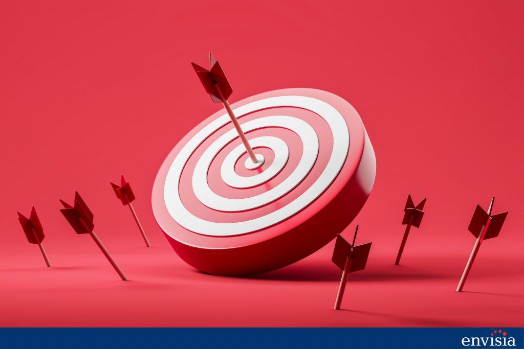 Target with arrows representing the goal of providing precise and constructive feedback to improve the 360-degree feedback system.