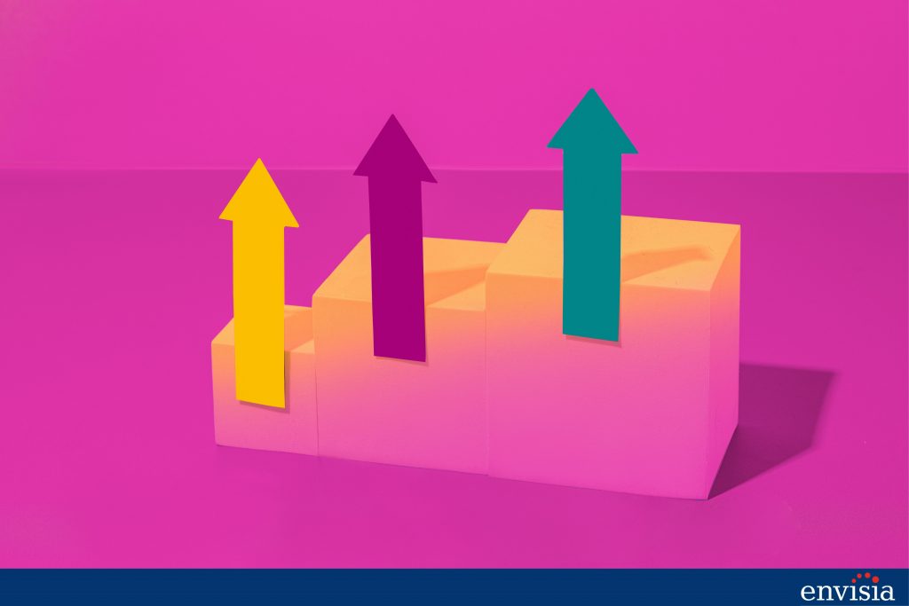 Colorful arrows on blocks representing progress and success in measuring leadership development.