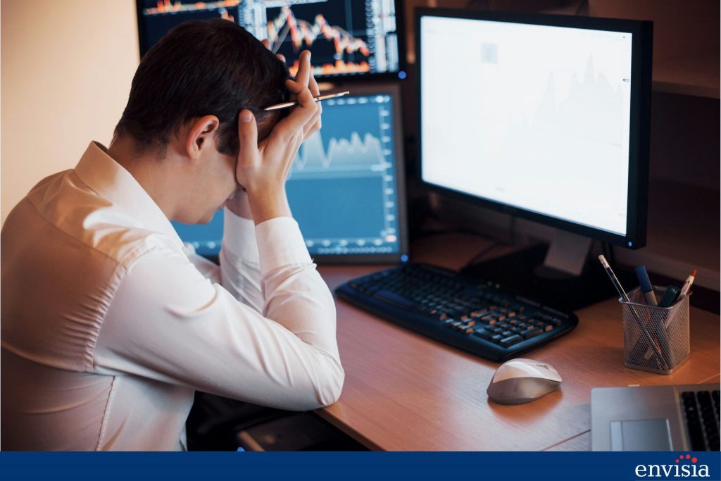 Stressed employee at desk illustrating the risks of implementing 360-degree feedback in high-pressure environments.