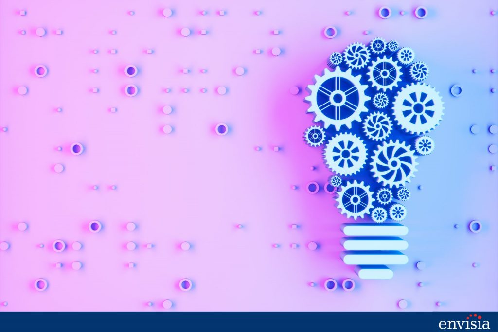 Illustration of a lightbulb with interlocking gears representing structured feedback and leadership development